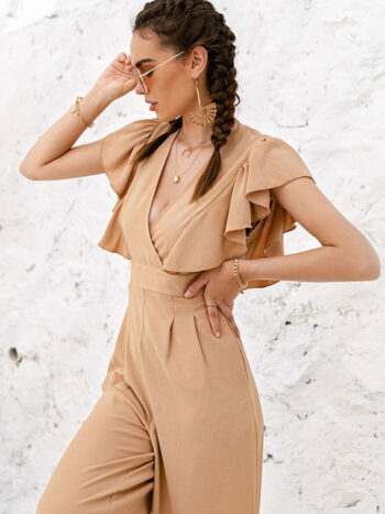 Enterizo beige acampanado y flecos en hombro
